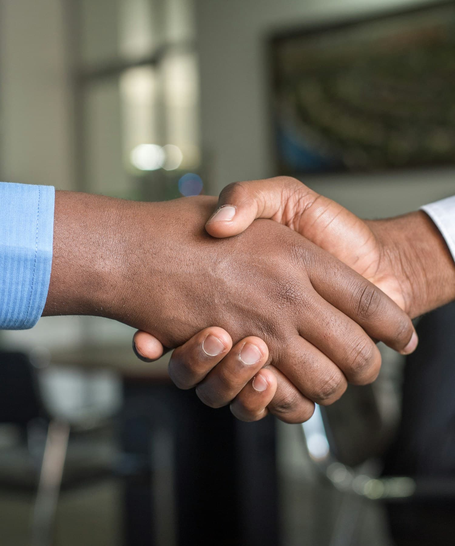 Two business partners shaking hands on a closed deal